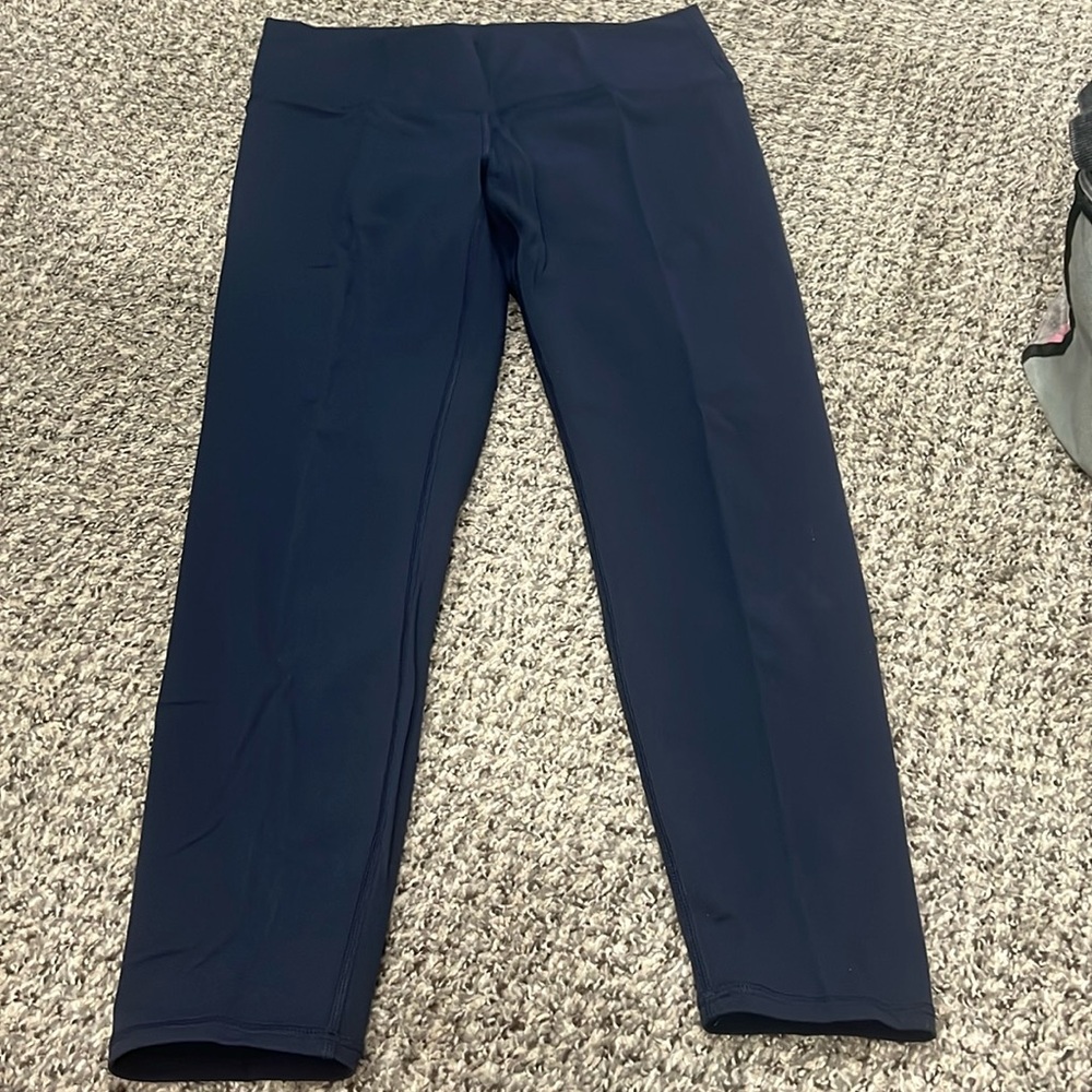 Navy leggings size 6-8.  Super soft. Never worked out in.  Only tried on